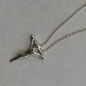 Tiffany & Co. Elsa Peretti crucifix with chain in sterling silver.